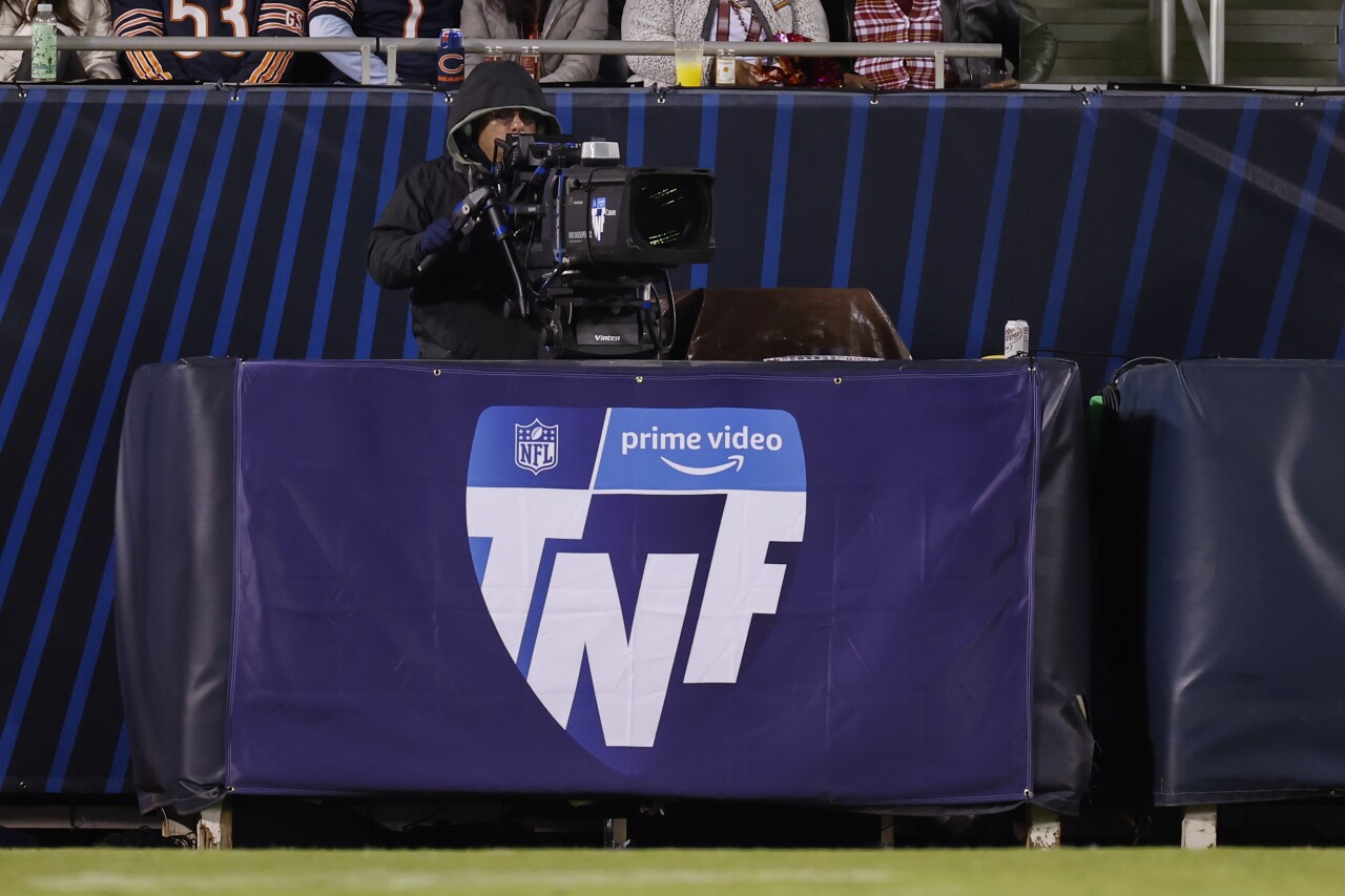 Cameraman at 'Thursday Night Football' game with Prime Video logo