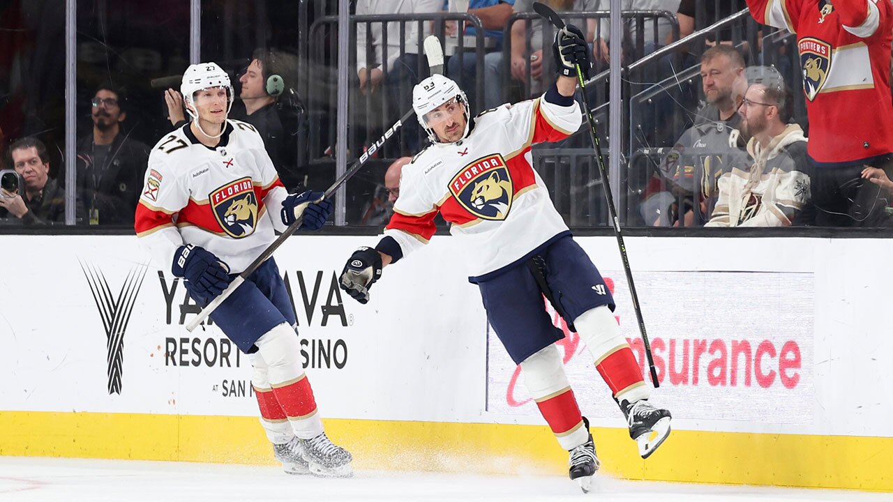 Florida Panthers center Eetu Luostarinen (27) and left wing Brad Marchand (63) celebrate after Marchand's goal against the Vegas Golden Knights during the second period of an NHL hockey game Monday, Nov. 10, 2025, in Las Vegas. (AP Photo/Ian Maule)