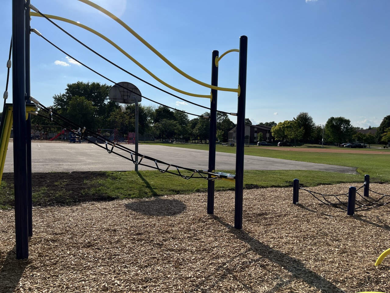 Kids can climb a rope course at the playground