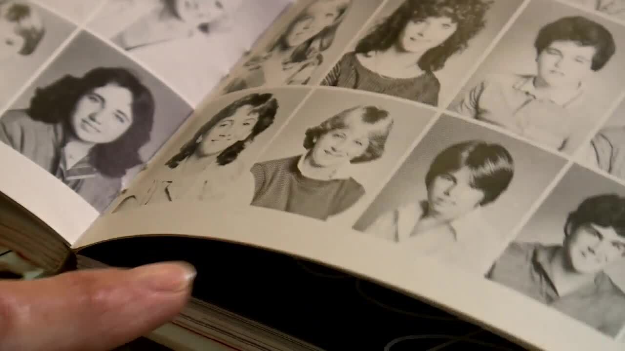 Diane Brewer points to yearbook photo of Karen Slattery