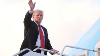 President Donald Trump waves as he boards Air Force One at Palm Beach International Airport in West Palm Beach Fla., on his way back to the White House following a weekend at his Mar-a-Lago estate, Sunday, Nov. 2, 2025. 