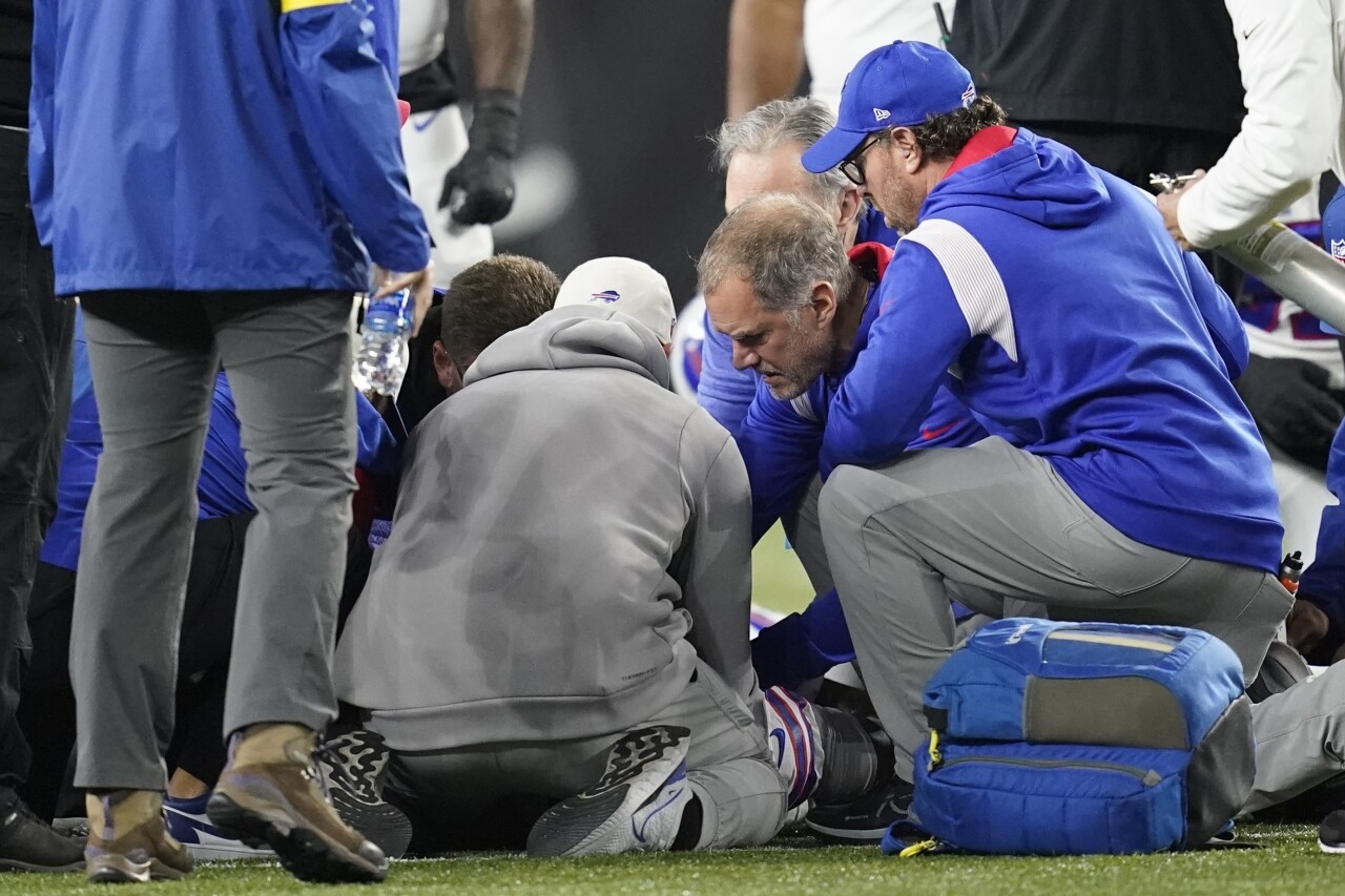 Medical staff examines Buffalo Bills safety Damar Hamlin, Jan. 2, 2023