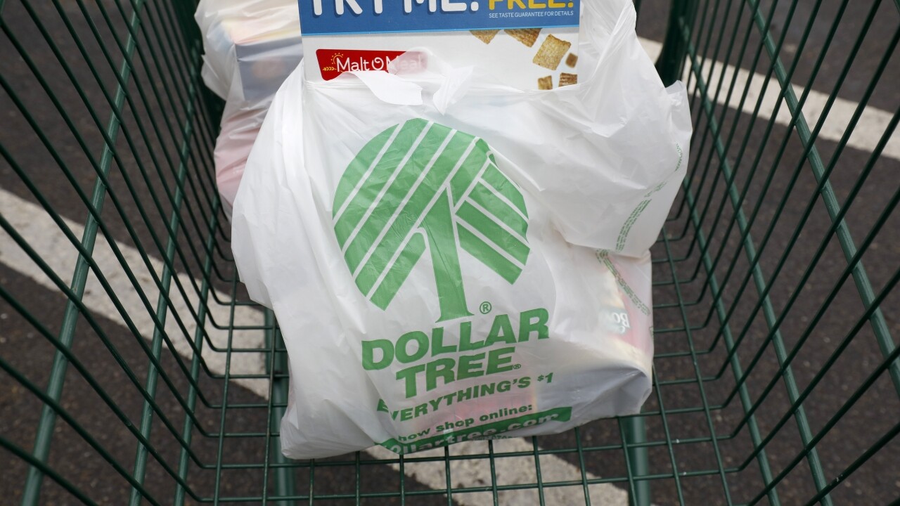 Dollar Tree shopping bags rest in a shopping cart