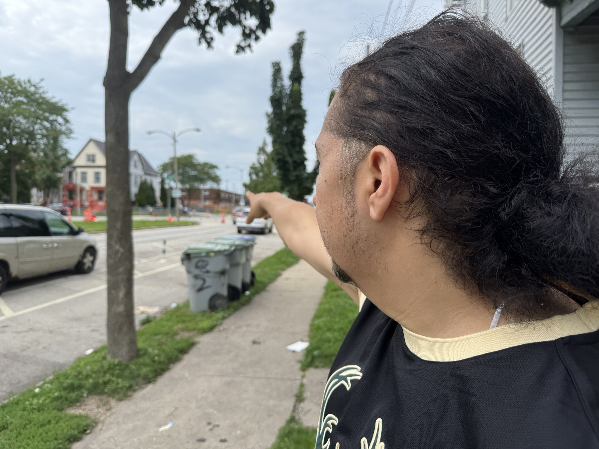 Jesus Ferreira points to the spot where he rushed to help Minerva. 