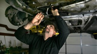 Mechanic Ed Wuerth of Wuerth Automotive works on a Volvo at his shop.