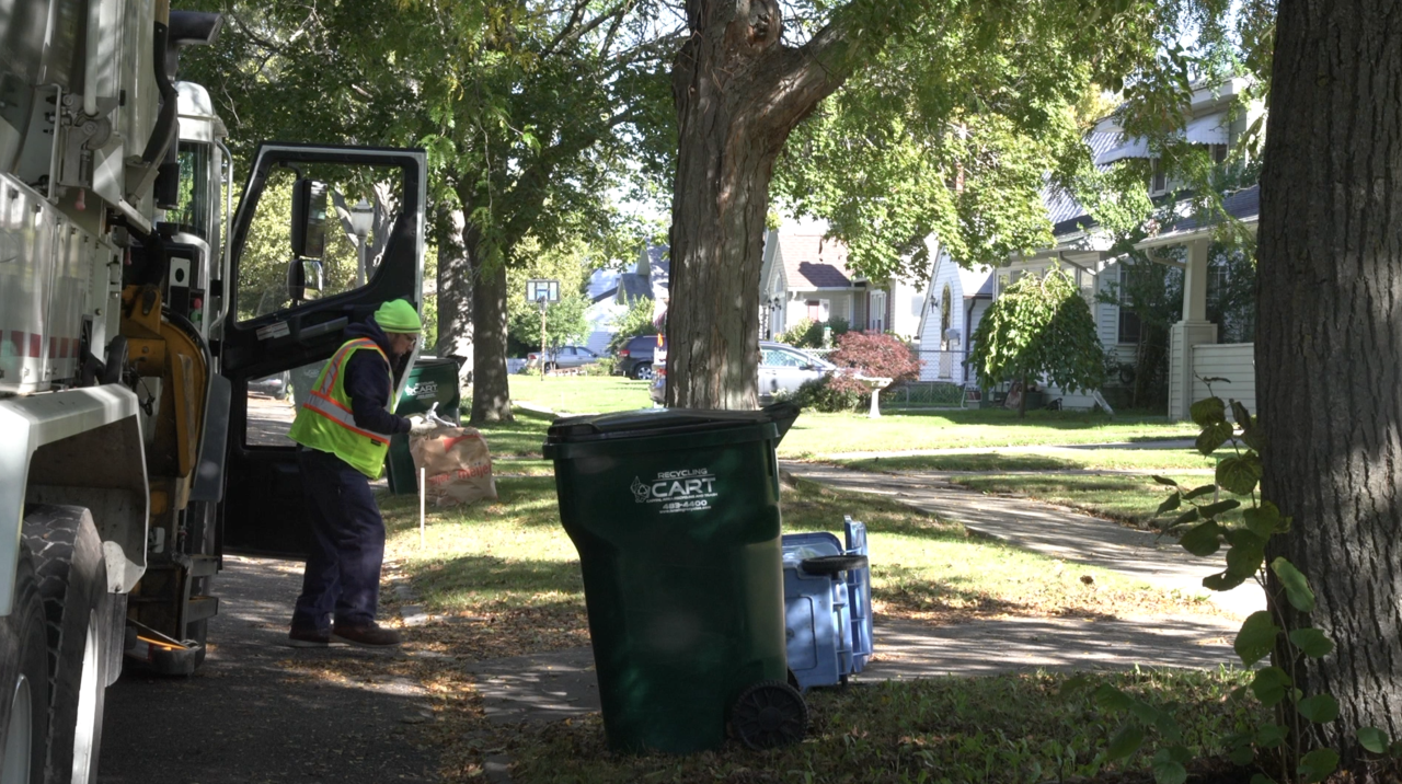 Staff member on his recycling route