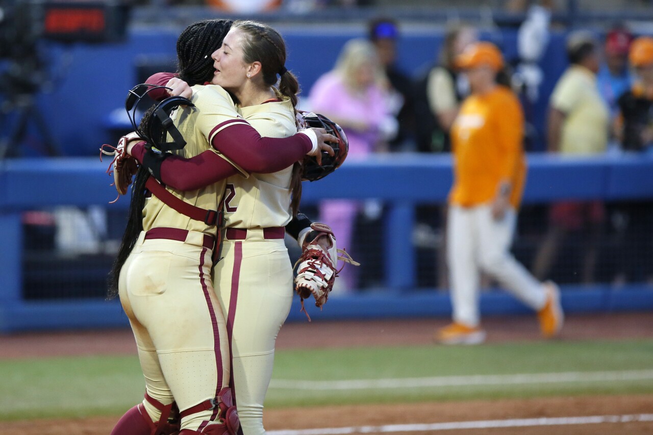 Florida State Seminoles catcher Michaela Edenfield and pitcher Kathryn Sandercock celebrate after win against Tennessee Lady Volunteers in Women's College World Series, June 5, 2023