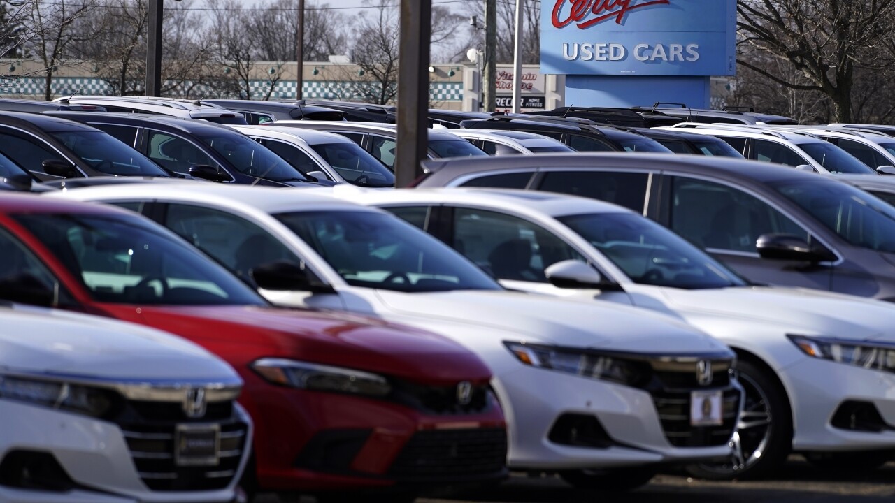 A dealership sign is seen outside of Honda certified used car dealership in Schaumburg, Ill.