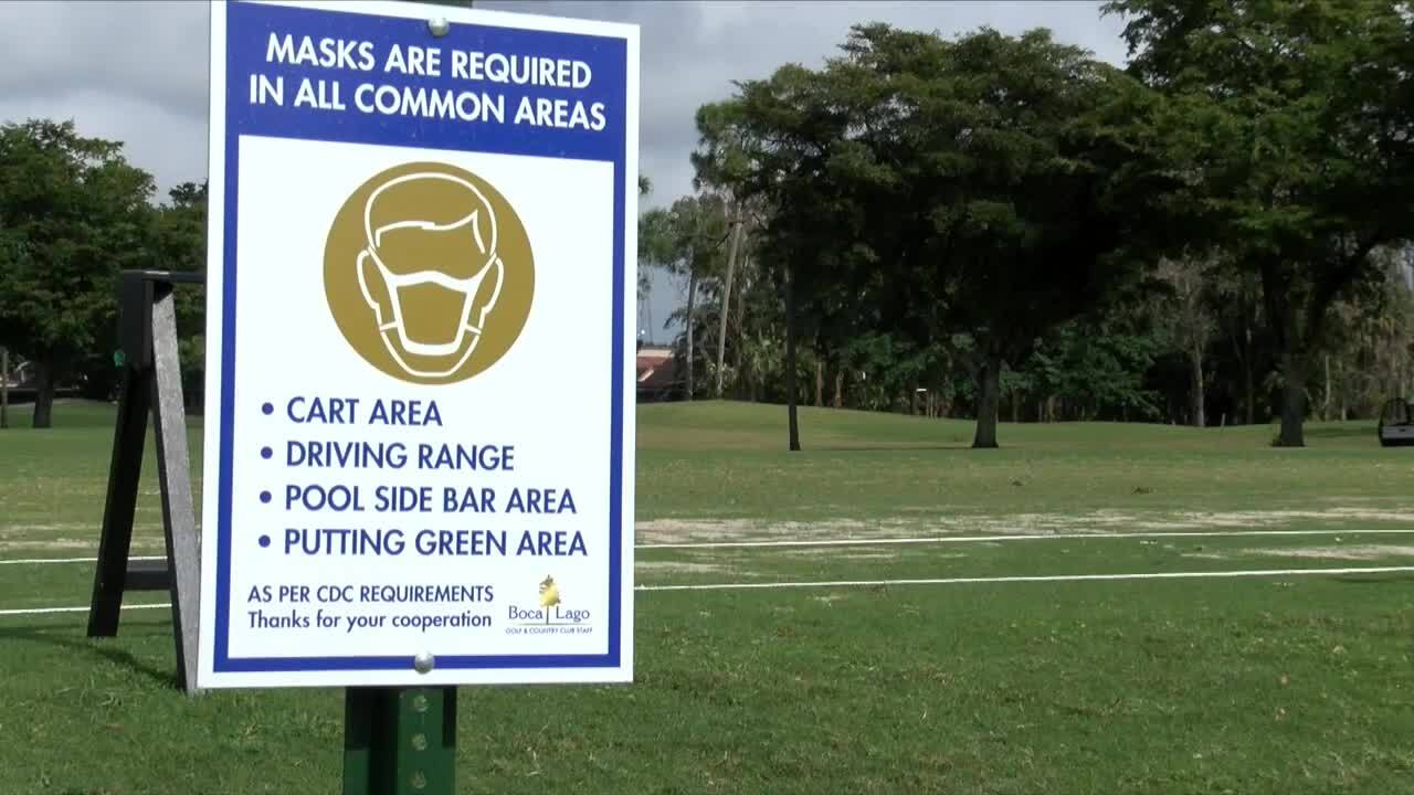 'Masks are required in all common areas' sign at Boca Lago Golf & Country Club