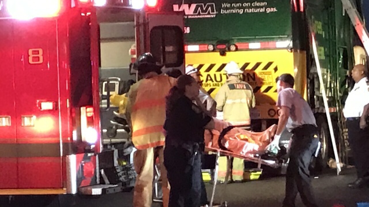 Tampa Firefighters rescue man dumped into garbage truck in