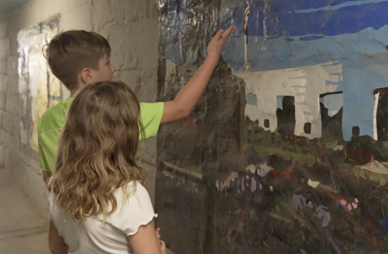 Mark shows Hannah painting