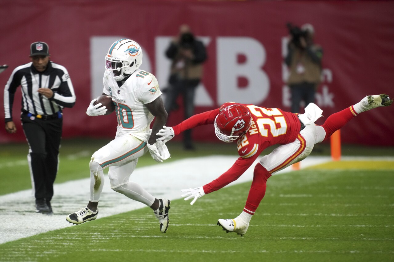 Miami Dolphins receiver Tyreek Hill runs out of bounds near Kansas City Chiefs cornerback Trent McDuffie in Frankfurt, Germany, Nov. 5, 2023