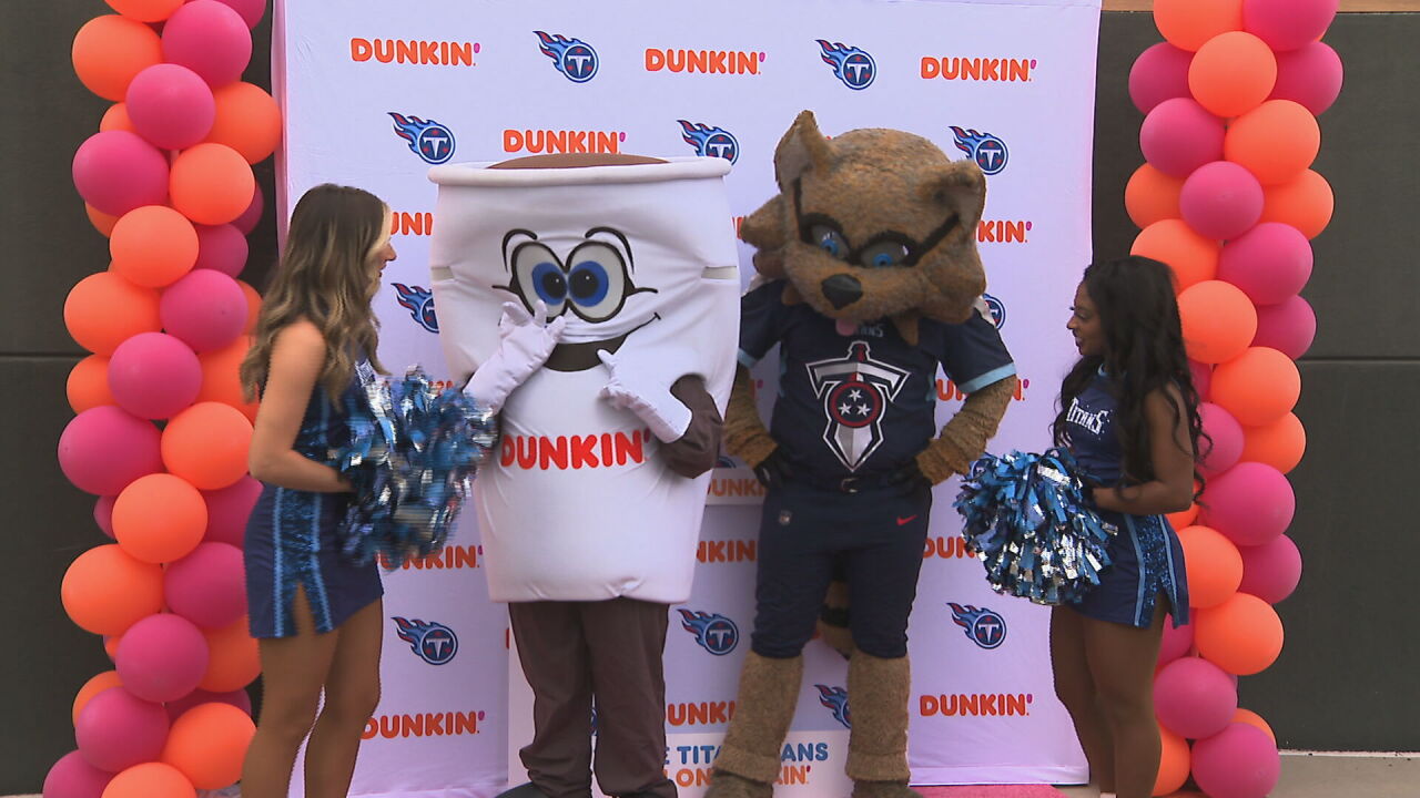 dunkin donuts and t-rac with cheerleaders launch titans donut