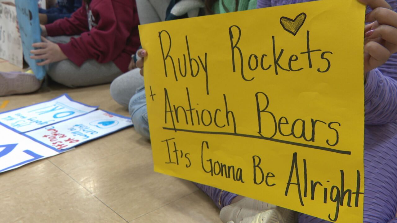 Elementary students sing Antioch High School a message of love and healing