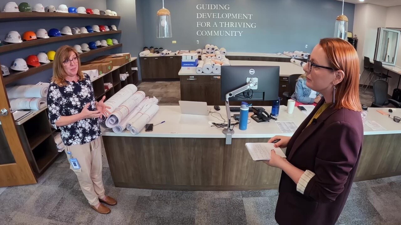 New Albany Community Development Director Jennifer Chrysler, left, talks to News 5 reporter Michelle Jarboe about the growth of data centers in the central Ohio city.