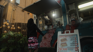 Ronicca Whaley, owner Shiso Crispy food truck, takes a customers order.