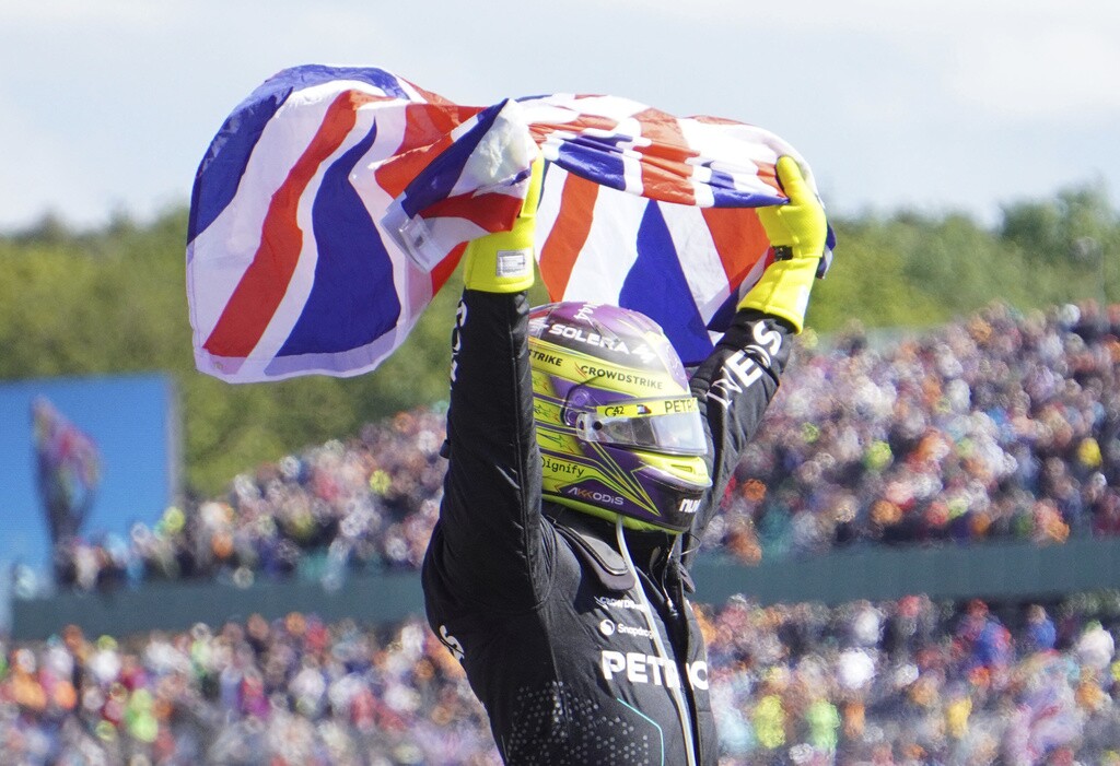 Mercedes driver Lewis Hamilton of Britain celebrates after winning the British Formula One Grand Prix race at the Silverstone racetrack.