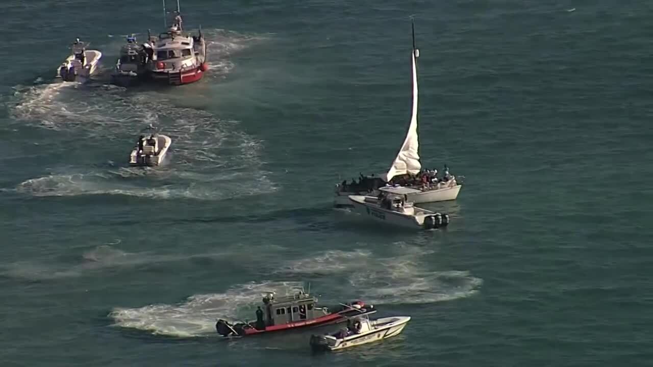 Aerial of overloaded sailboat filled with migrants in Biscayne Bay near Virginia Key, Jan. 12, 2023