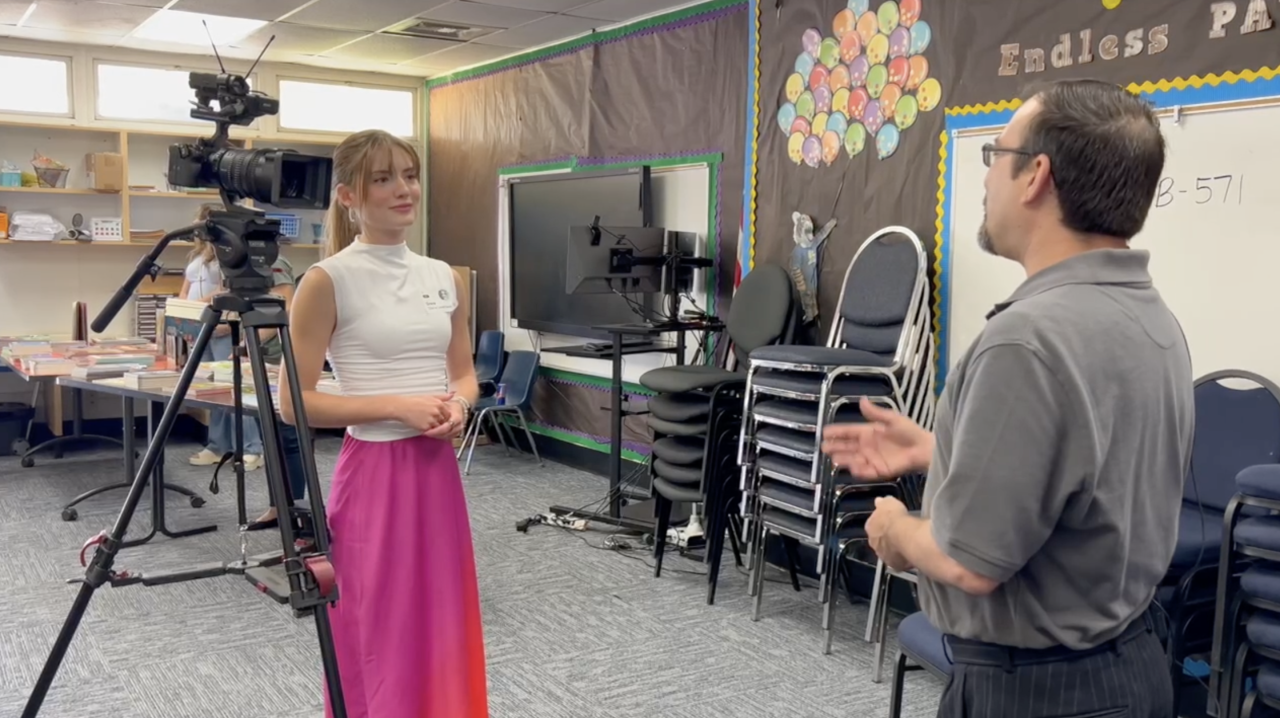Neighborhood Reporter Grace Laverriere interviewing Ian Anderson from the KLC about the importance of reading and providing free books to kids
