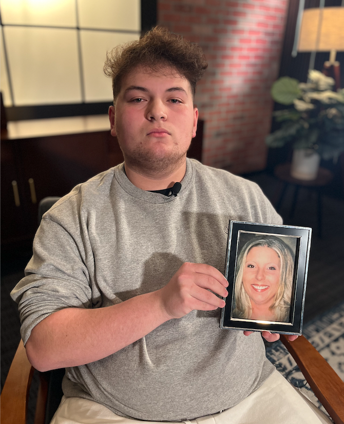 Robby holding picture of his mom.png
