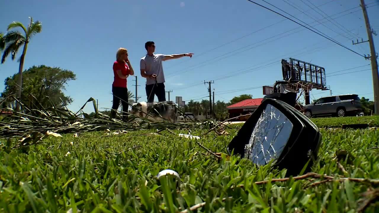 Zach Means shows where tornado tossed his car into air as broken windshield rests in grass, May 1, 2023