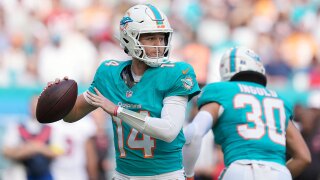 Miami Dolphins quarterback Quinn Ewers (14) looks to pass against the Tampa Bay Buccaneers during the first half of an NFL football game Sunday, Dec. 28, 2025, in Miami Gardens, Fla.