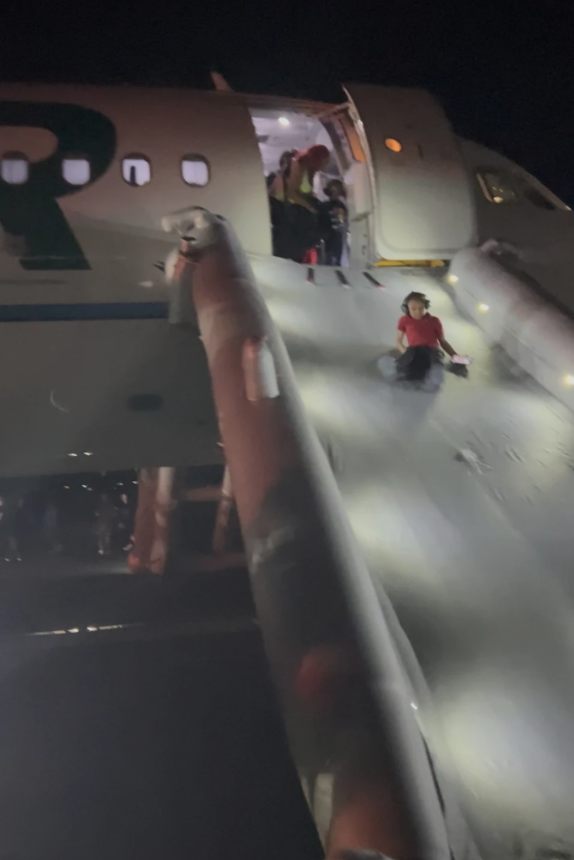 This image provided by Jack Estenssoro, passengers evacuate an airplane after a person was struck and killed by a Frontier Airlines plane during takeoff, at Denver International Airport, Friday, May 8, 2026, in Denver.