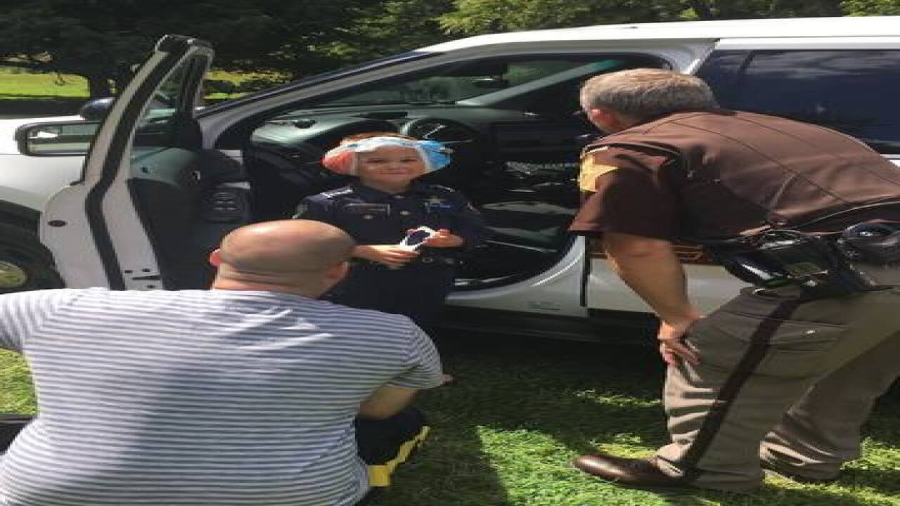 Police, fire, EMS cheer up boy after surgery