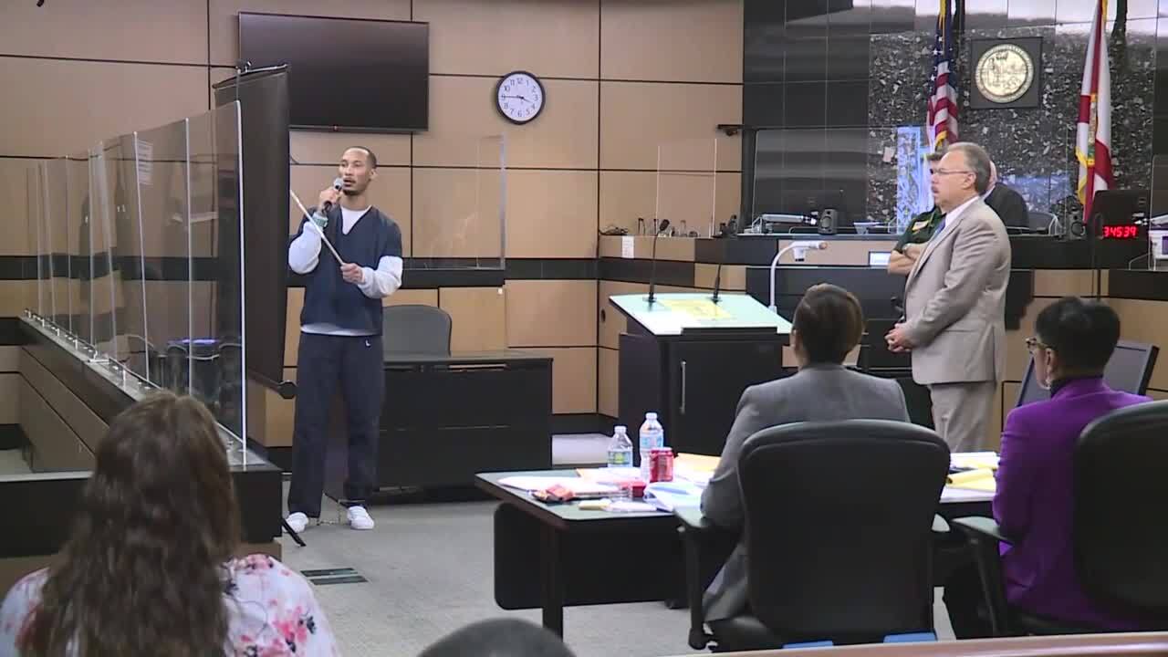 Defense attorney Marc Shiner looks as Travis Rudolph points to projector during 'stand your ground' hearing, March 8, 2022