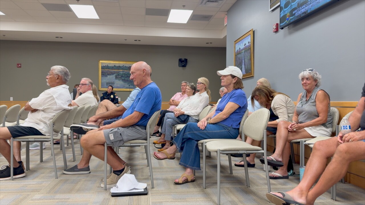 Residents watch Marco Island City Council debate millage rates. 
