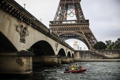 A rescue boat cruises on the Seine river near the Eiffel Tower during a rehearsal for the Paris 2024 Olympic Games opening ceremony