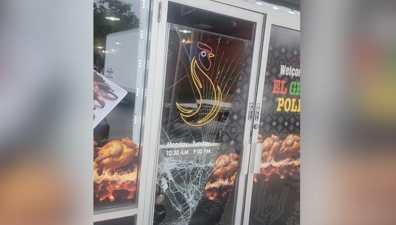 Damage on the front door of El Gran Pollo