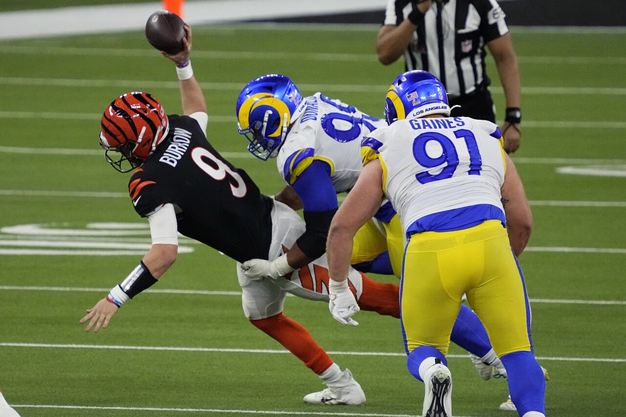 Los Angeles Rams defensive end Aaron Donald tackles Cincinnati Bengals QB Joe Burrow in fourth quarter of Super Bowl LVI