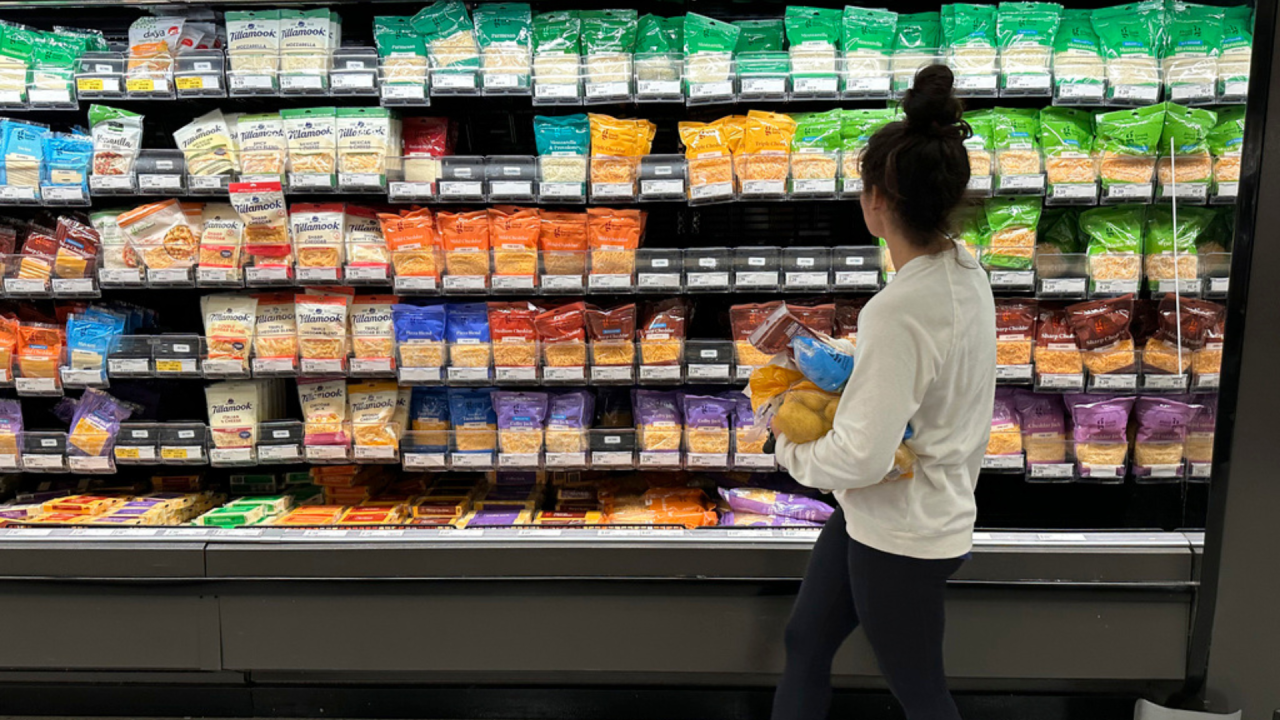 shopper peruses cheese offerings at a Target store.