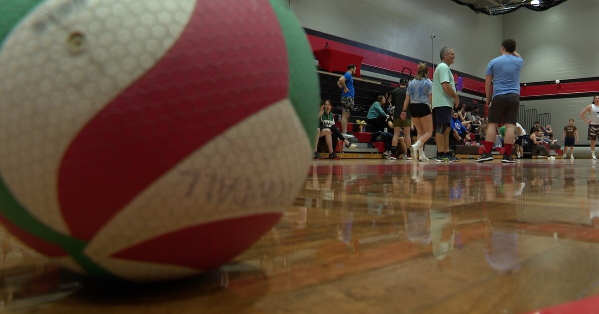 Dozens hit the volleyball court all to help someone close to their heart