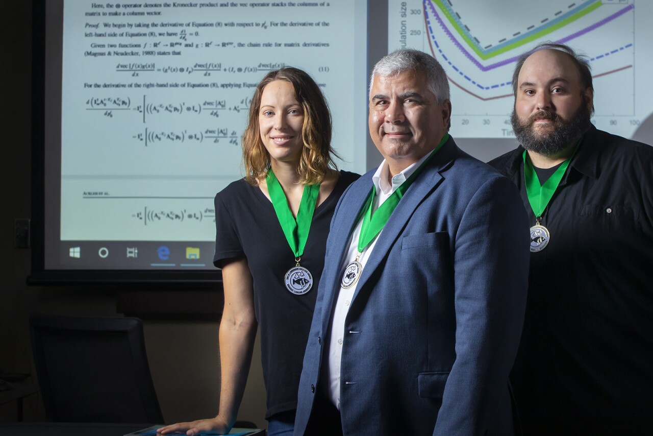 From left, Dr. Amy Veprauskas, Dr. Azmy S. Ackleh and Dr. Ross Chiquet, recipients of the Rollie Lamberson Research Award. (Photo credit: Doug Dugas / University of Louisiana at Lafayette)