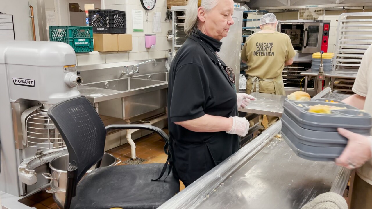 Kitchen staff at the Cascade County Detention Center prepares hundreds of meals per day