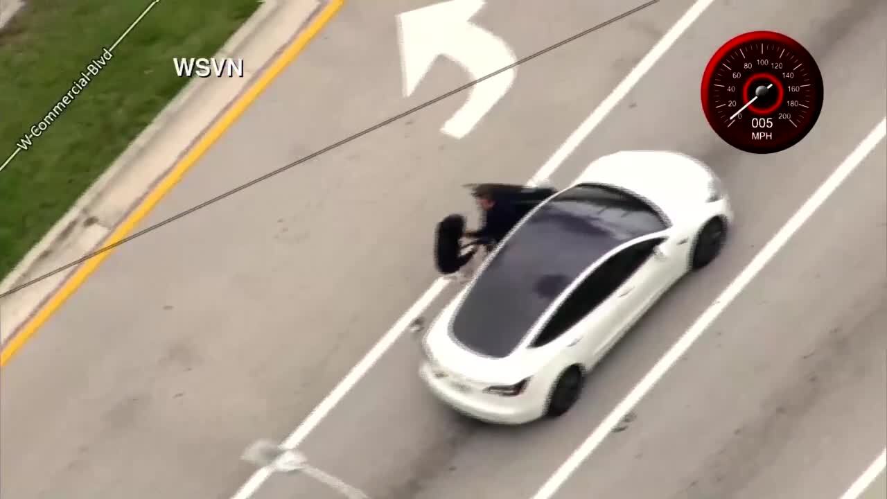 gunman carjacks driver of Tesla, April 19, 2023