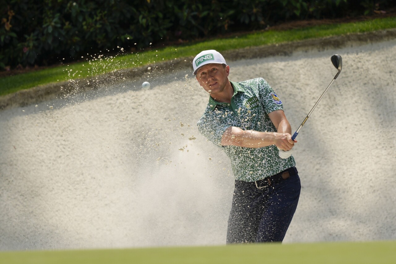 Mackenzie Hughes hits from bunker on 13th hole during first round of Masters tournament, April 6, 2023