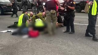 Authorities respond to the scene of a shooting at a "No Kings" protest in Salt Lake City, Utah. 