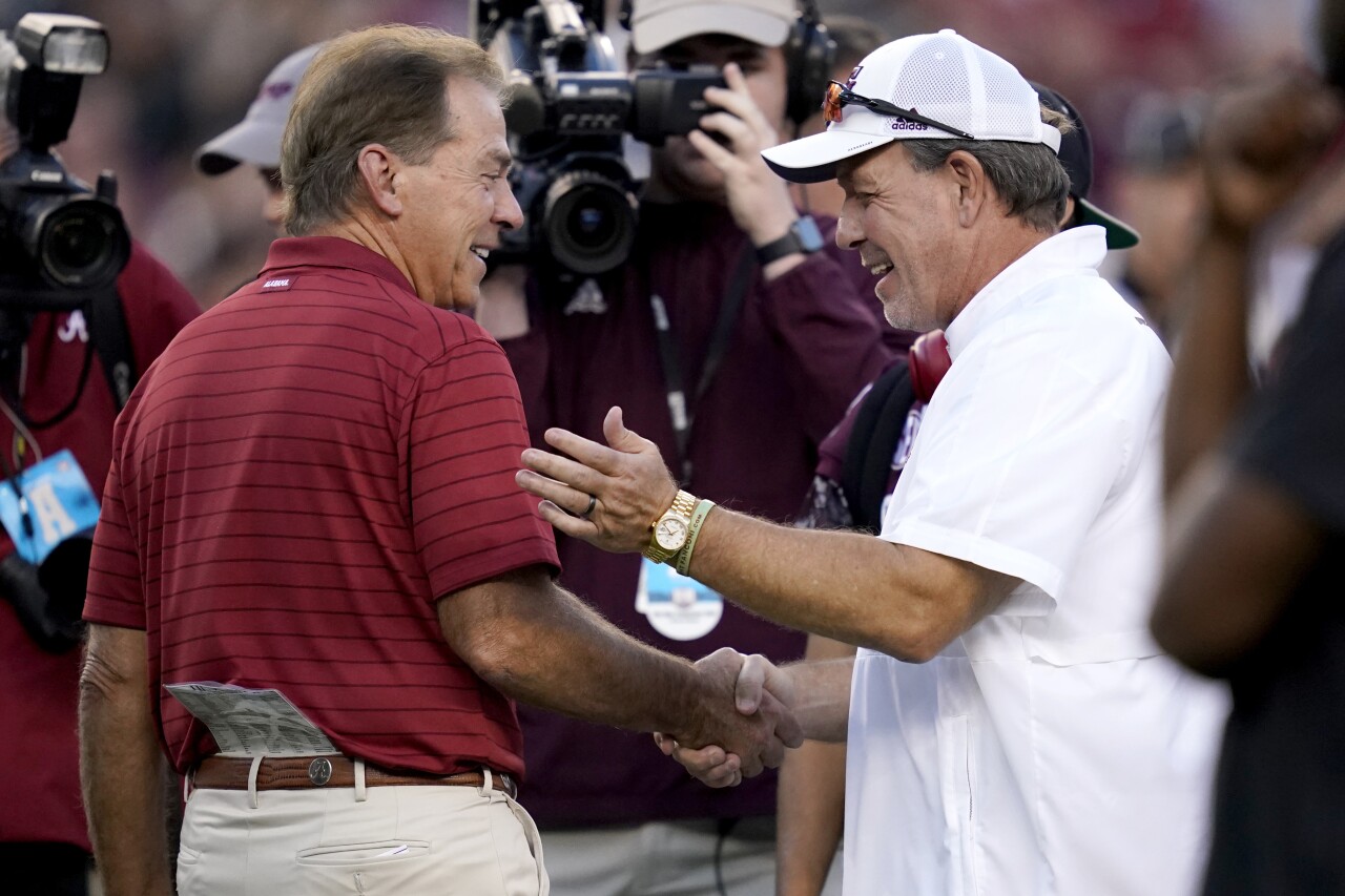 Alabama Crimson Tide head coach Nick Saban and Texas A&M Aggies head coach Jimbo Fisher shake hands before 2021 game