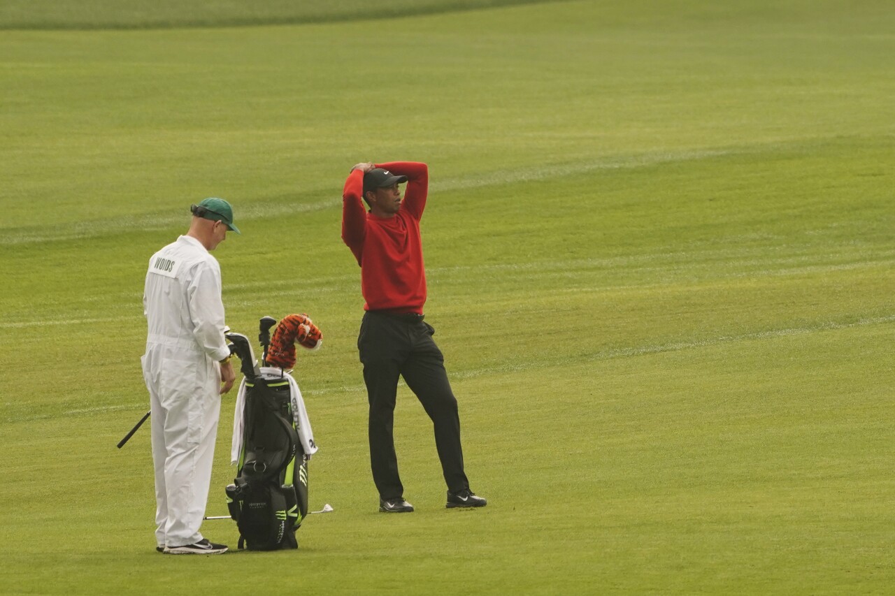 Tiger Woods drops club after missing