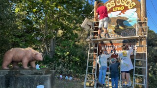 Volunteers restoring the Los Osos-Baywood Park welcome sign and bear statue on Los Osos Valley Road