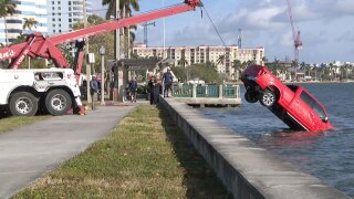 A pickup truck is pulled from the Intracoastal Waterway in West Palm Beach on Feb. 15, 2026.