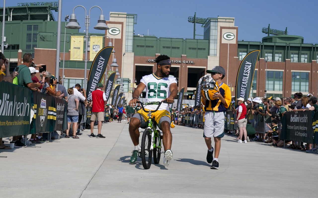 Malik Taylor takes part in riding bikes to practice, a Packers tradition