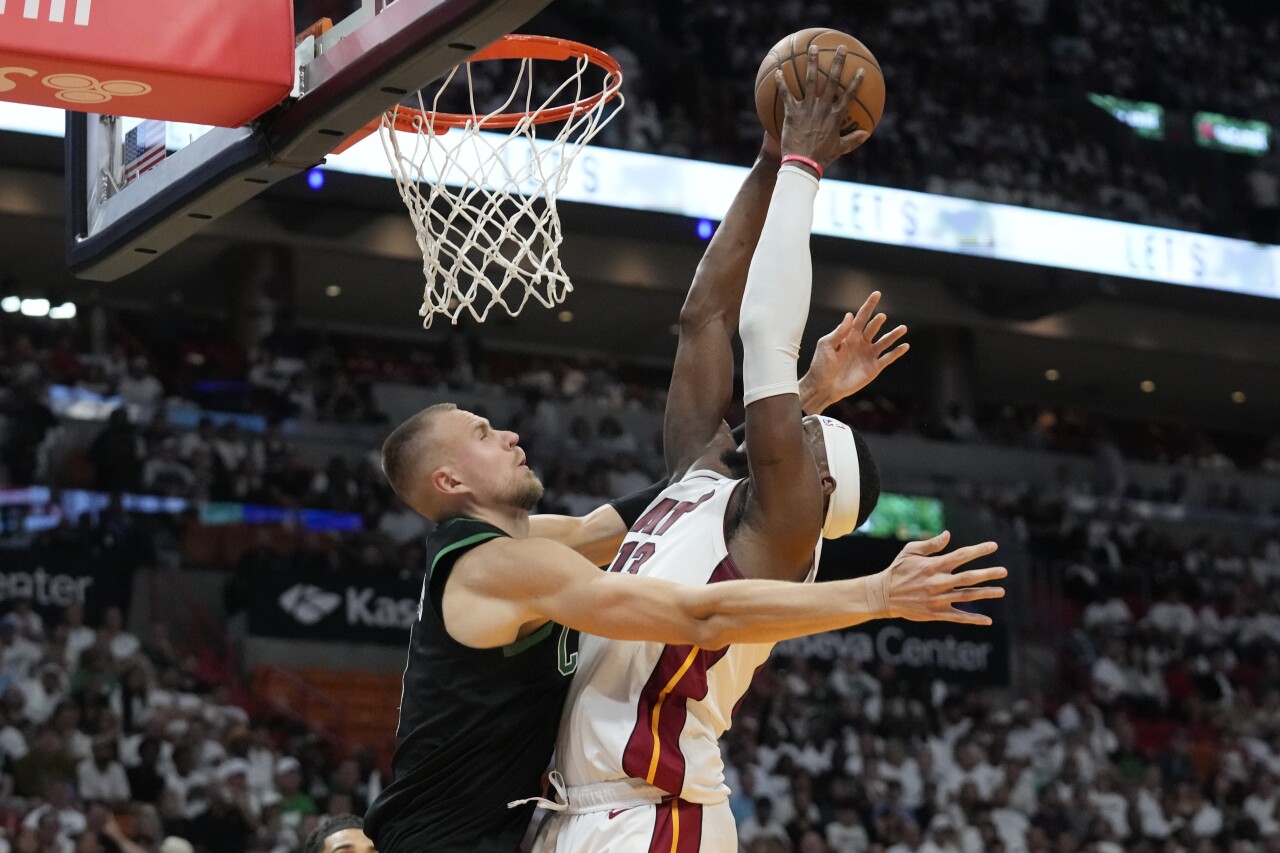 Miami Heat center Bam Adebayo goes up for shot against Boston Celtics forward Kristaps Porzingis during second half, April 27, 2024