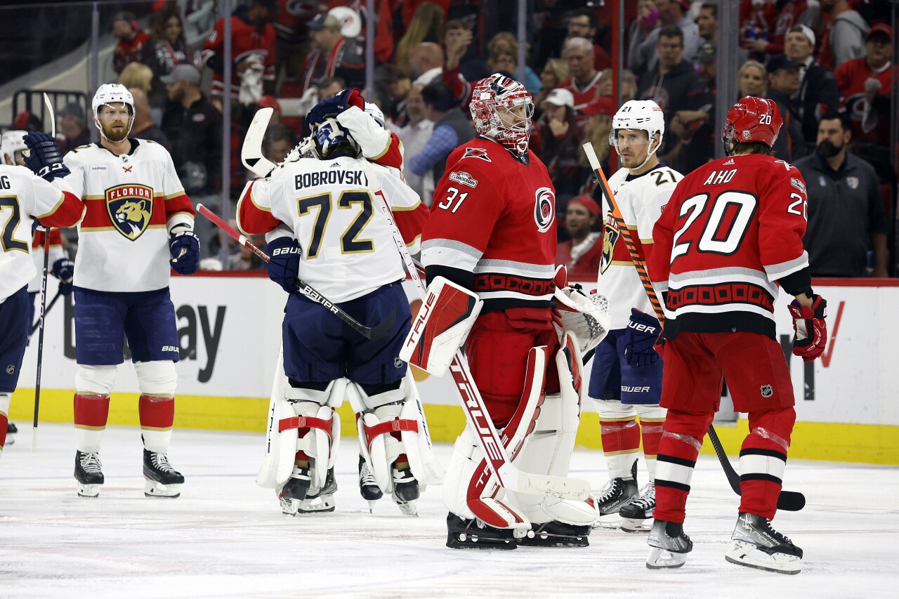 Carolina Hurricanes goaltender Frederik Andersen talks with Sebastian Aho during celebration for OT goal later disallowed during Game 1 of NHL Eastern Conference final, May 18, 2023