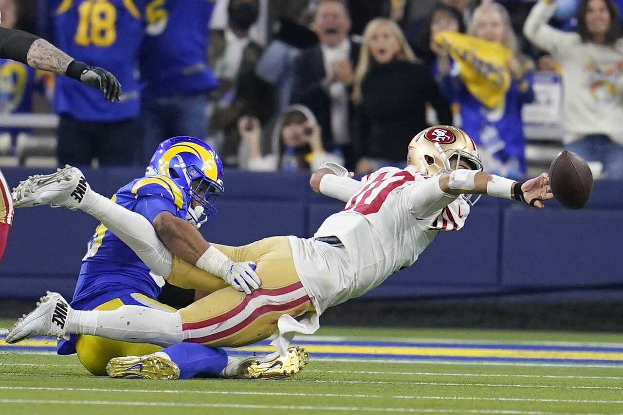 San Francisco 49ers QB Jimmy Garoppolo throws interception as he's taken down vs. Los Angeles Rams in NFC Championship, Jan. 30, 2022