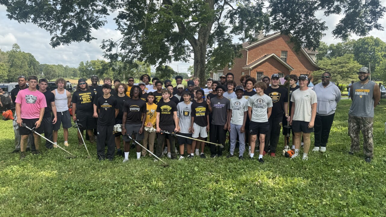 Woodford High School football players clean up historic Black cemetery in Huntertown