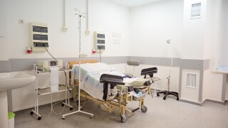 Empty,Delivery,Room,With,Bed,And,Medical.,Space,For,Text.